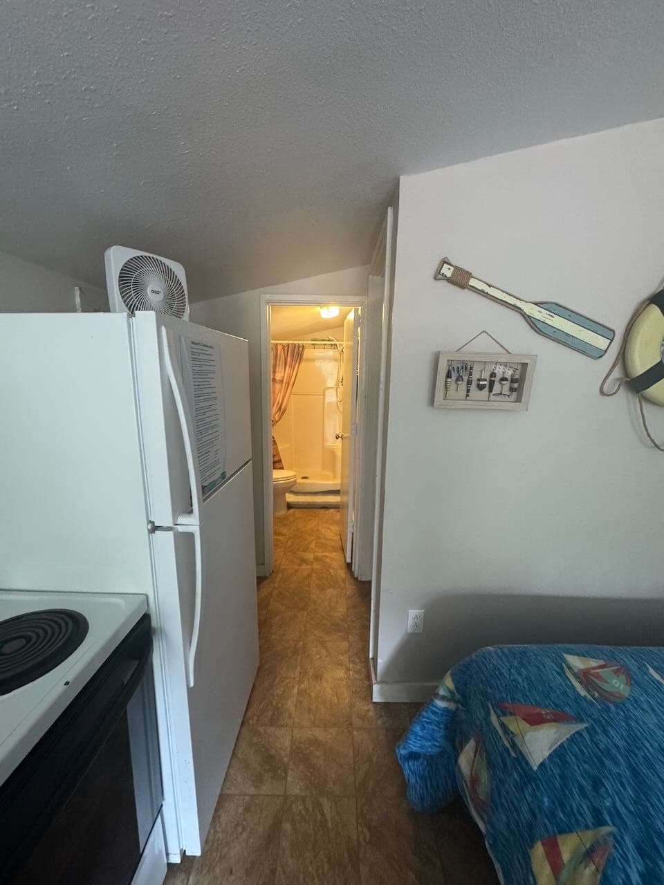 Kitchenette looking into the bathroom