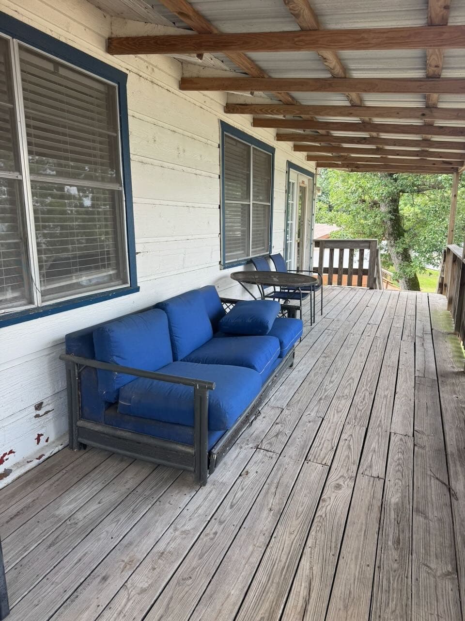 Porch seating with blue sofa