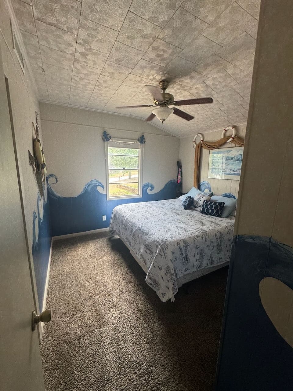 Bedroom with lake mural
